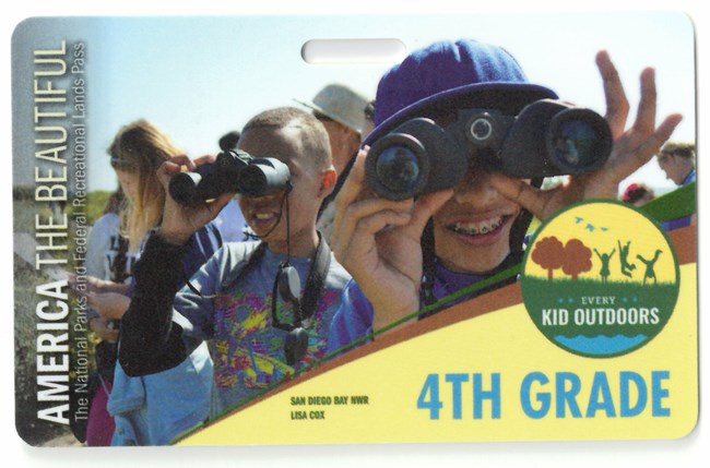 Every Kid Outdoors Pass. Depicts children looking through binoculars.
