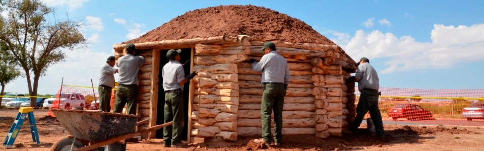 NPS Staff working on traditional Navajo home