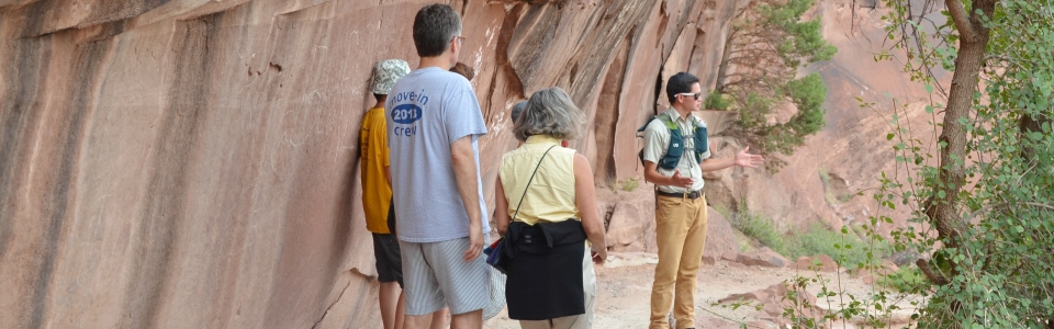 Volunteer talking with visitors