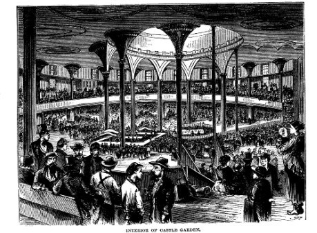 A large open interior of a building crowded with people