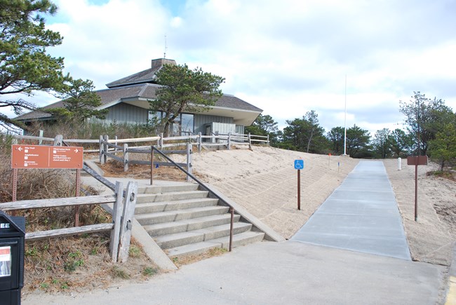 Image of stairs and ramp leading up to visitor center.