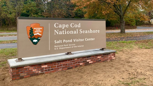 Brown entrance sign for the Salt Pond Visitor Center.
