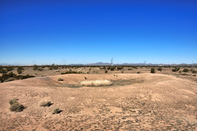 photo of the remains of an ancient ballcourt mound