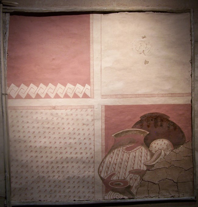 in the theater flat wall art in shades of red and buff reminds of the historic pottery and art of the ancient Sonoran Desert people
