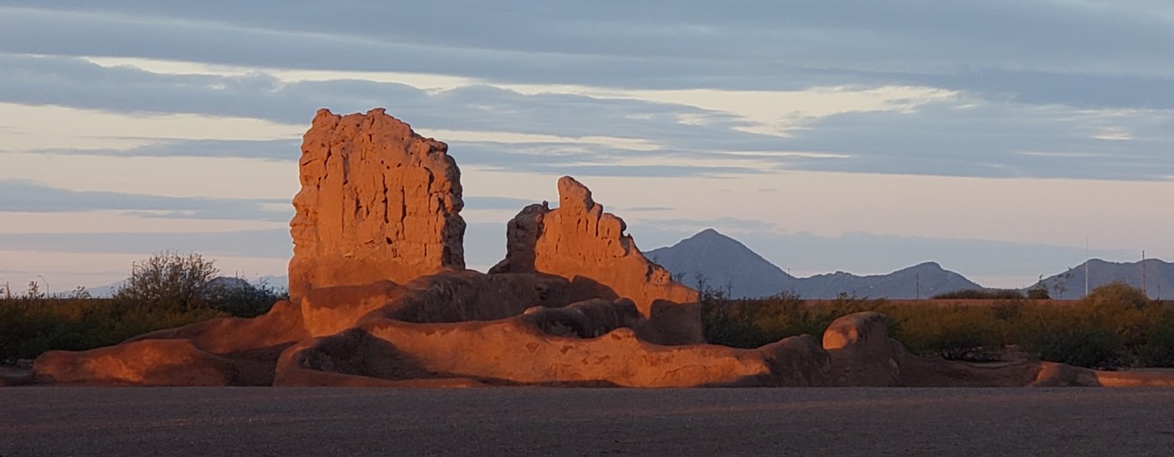 A view of a ruins structure at sunrise