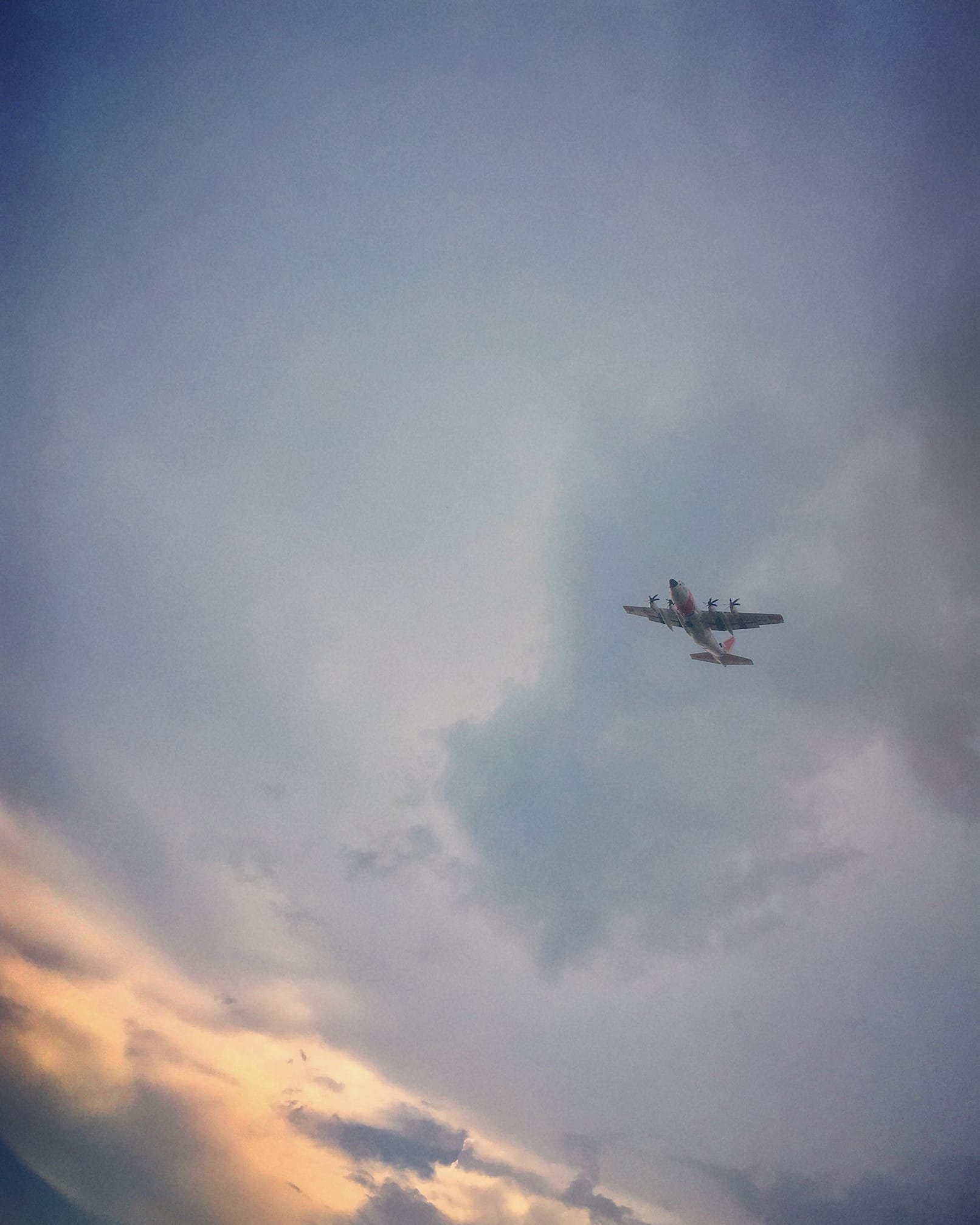 Photo of a U.S. Coast Guard flyover taken from the ground.