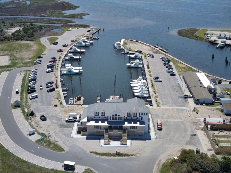 Aerial view of the replacement marina store and restaurant facility at the Oregon Inlet Marina. Aerial view of the Oregon Inlet Marina.