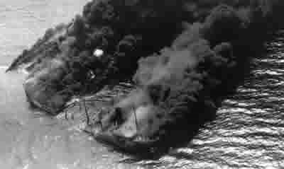The tanker Byron D. Benson burns off the North Carolina coast, April 3, 1942.