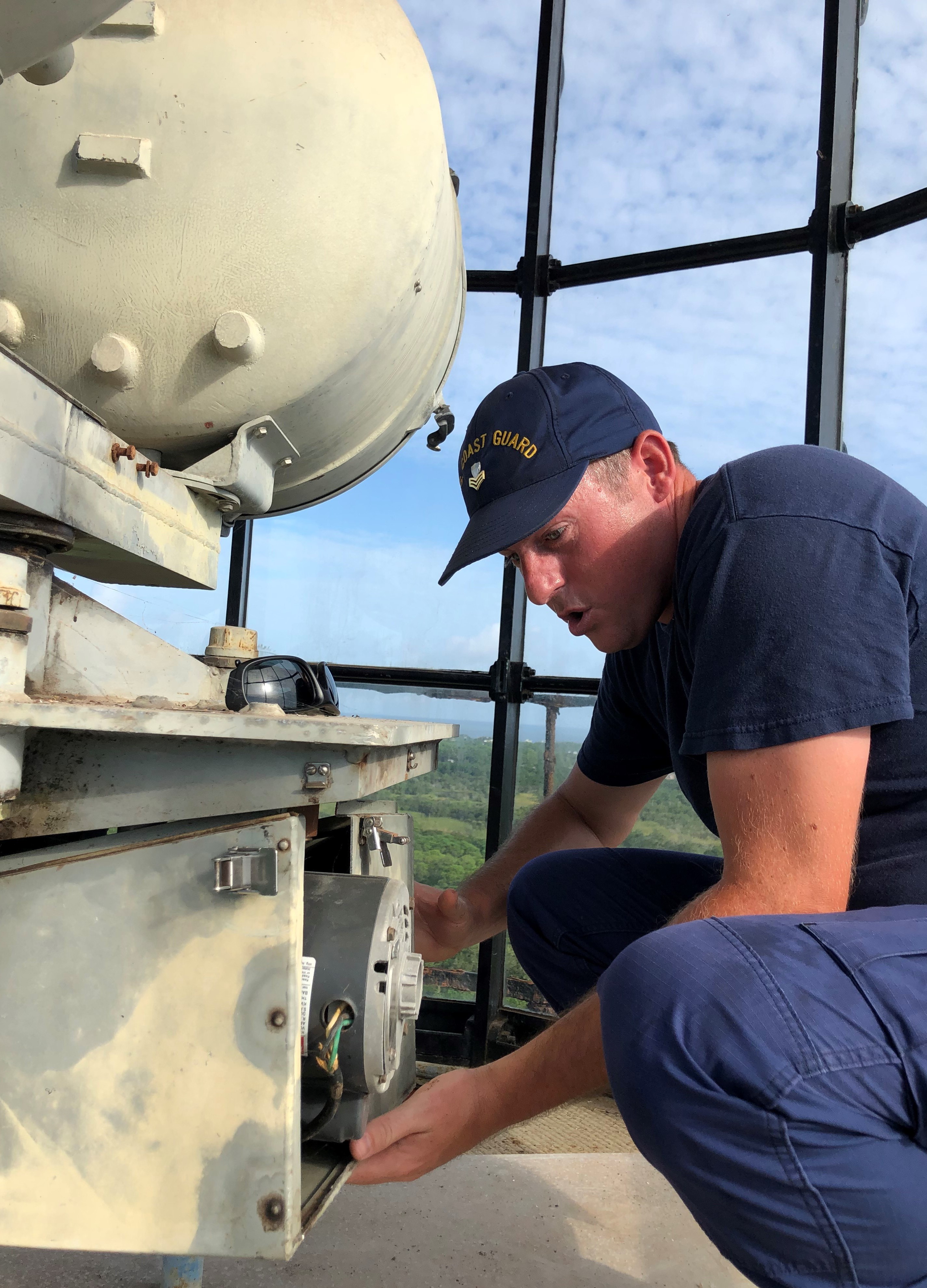 Coast Guard Electrians Mate 1st Class James Harper working on the Cape Hatteras Light.