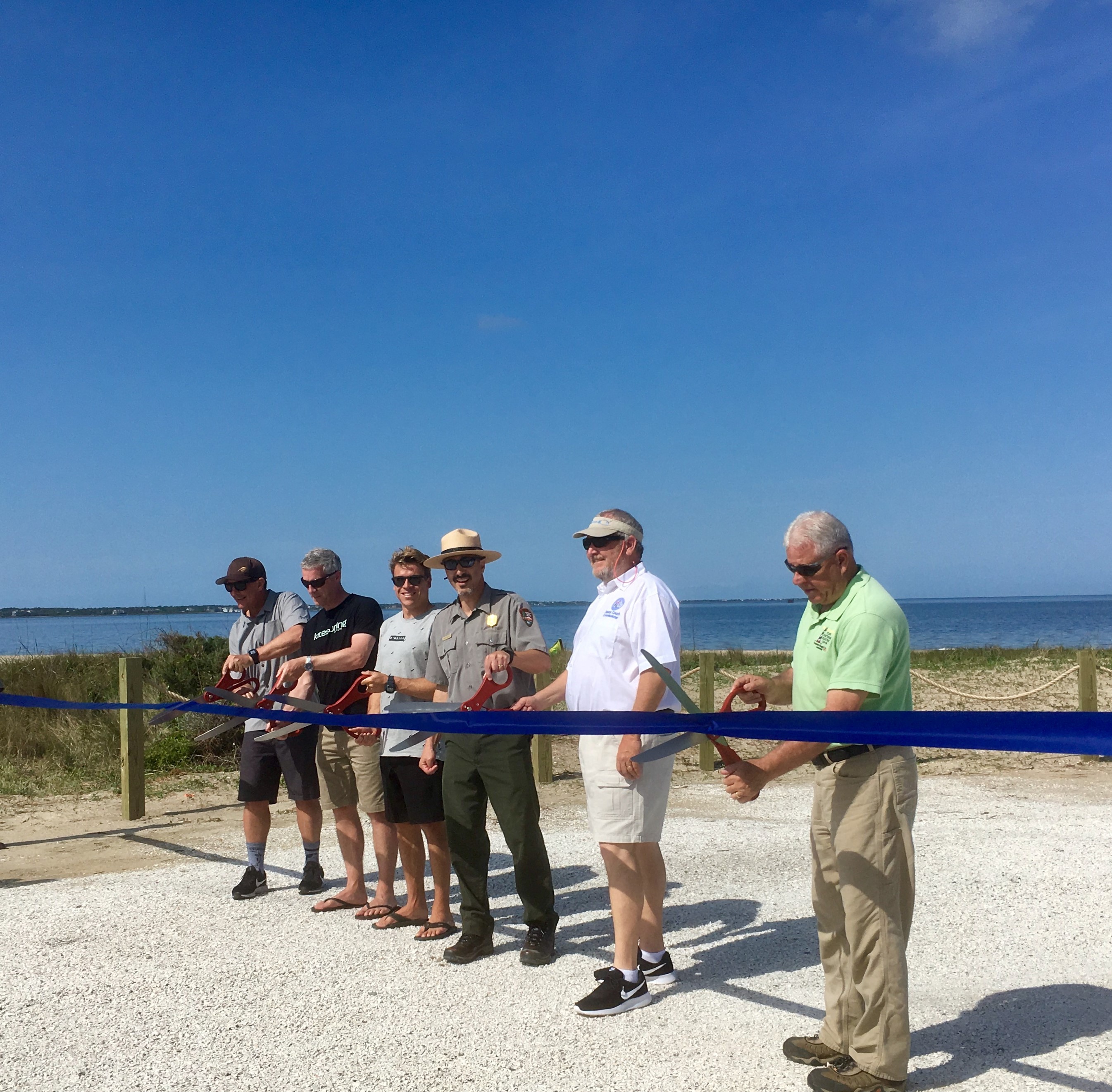 Kite Point Parking Area Ribbon Cutting - Uncut Ribbon 05-01-19 Superintendent David Hallac and others preparing to cut ribbon at Kite Point parking area ribbon cutting event.