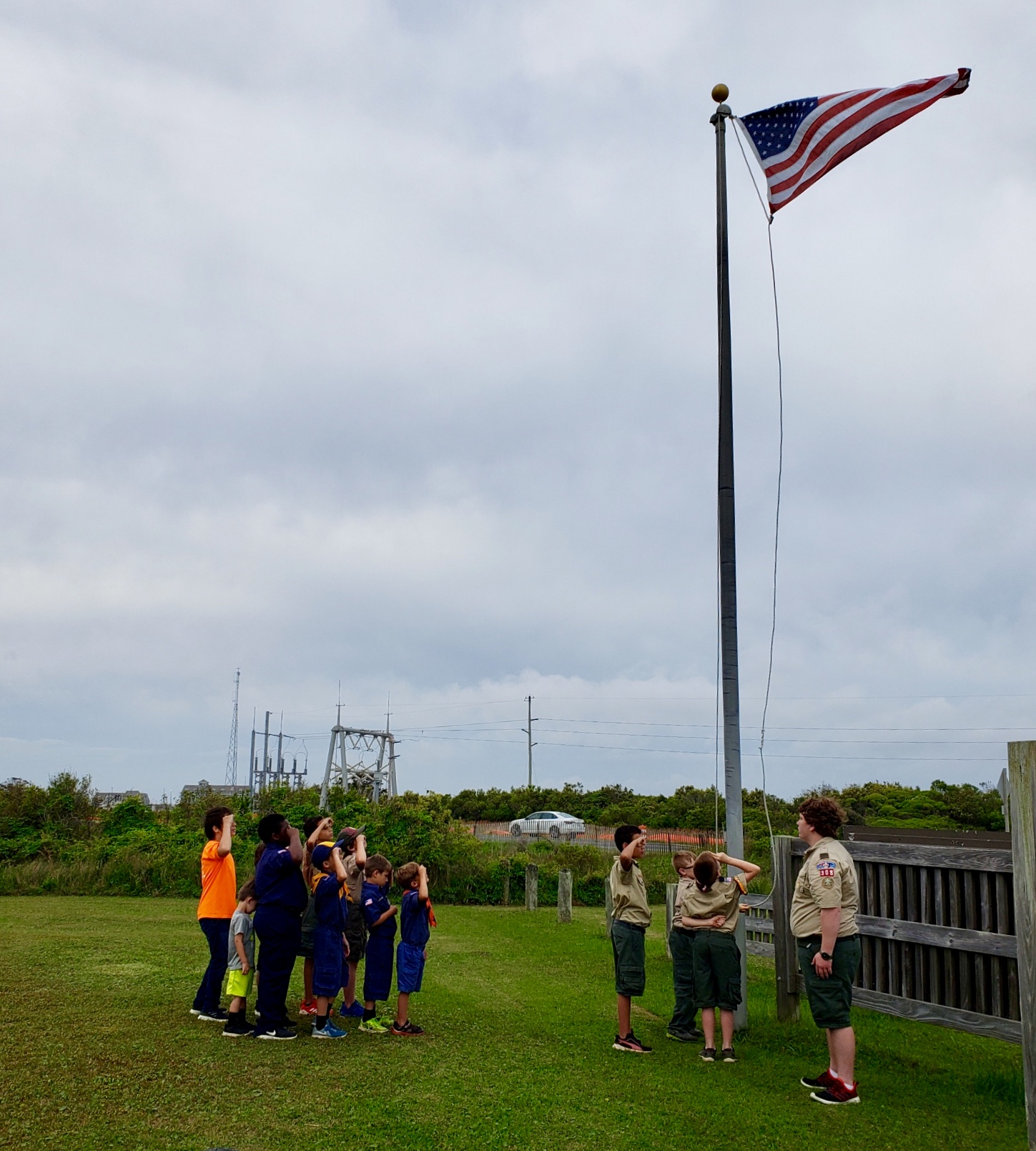Troop 308 from Cleveland, NC raising the flag at Oregon Inlet Campground