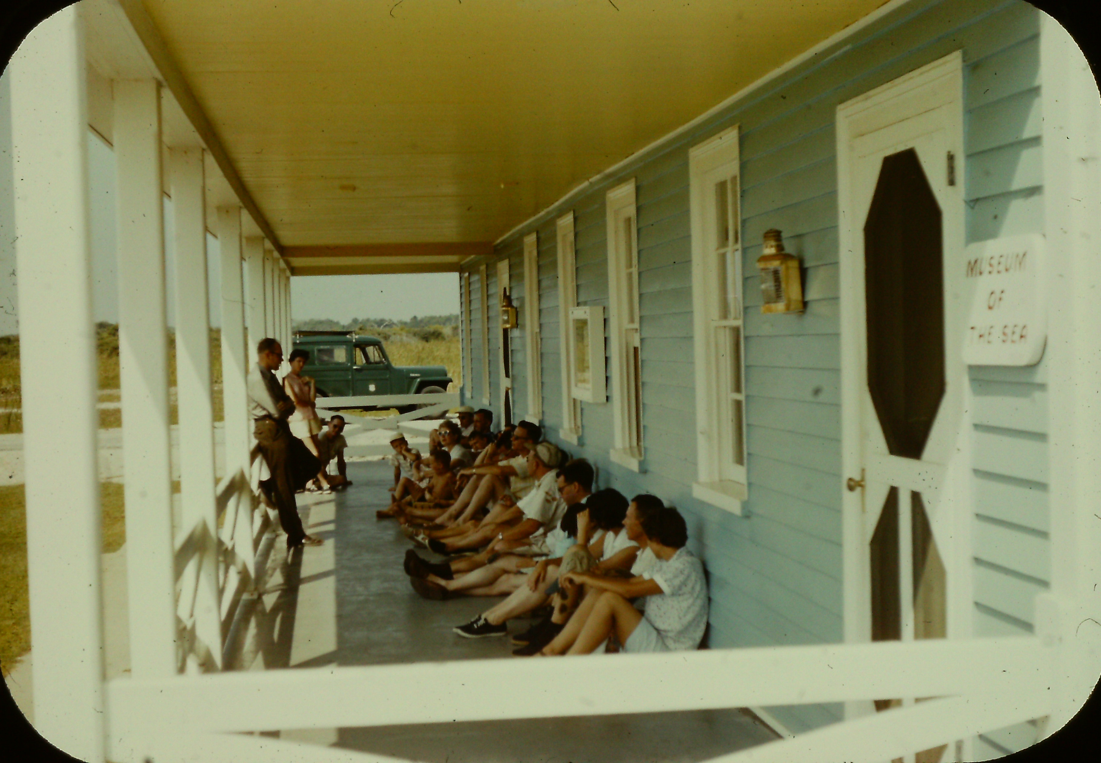 Visitors sit for an interpretive program on the porch of the Double Keepers’ Quarters, Cape Hatteras Light Station.