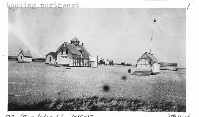 Black and white image of life saving station buildings.