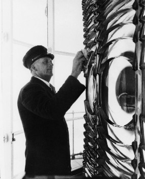 Lightkeeper Unaka Jennette cleaning the first order Fresnel lens.