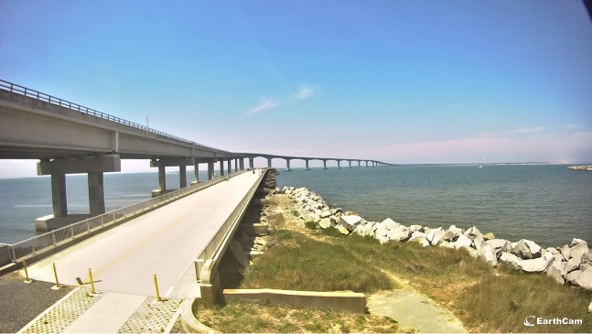 concrete pier extending out into the ocean