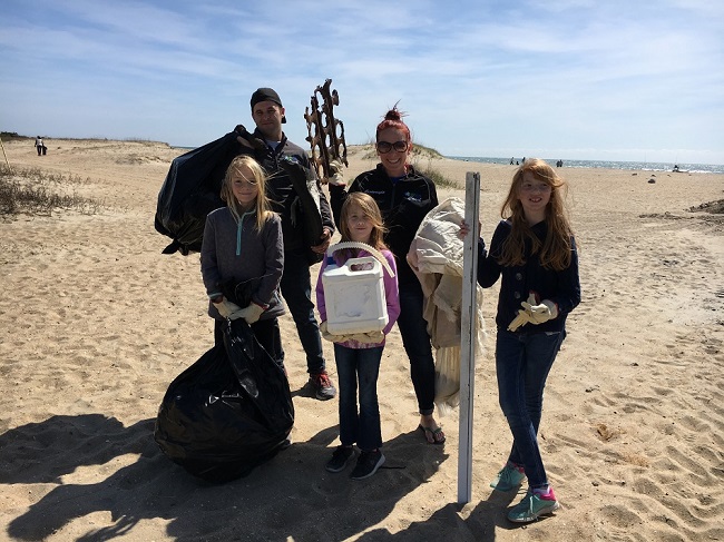 Family of volunteers at a beach cleanup