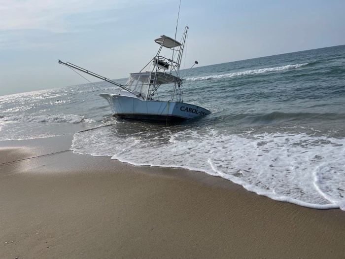 Grounded blue vessel.