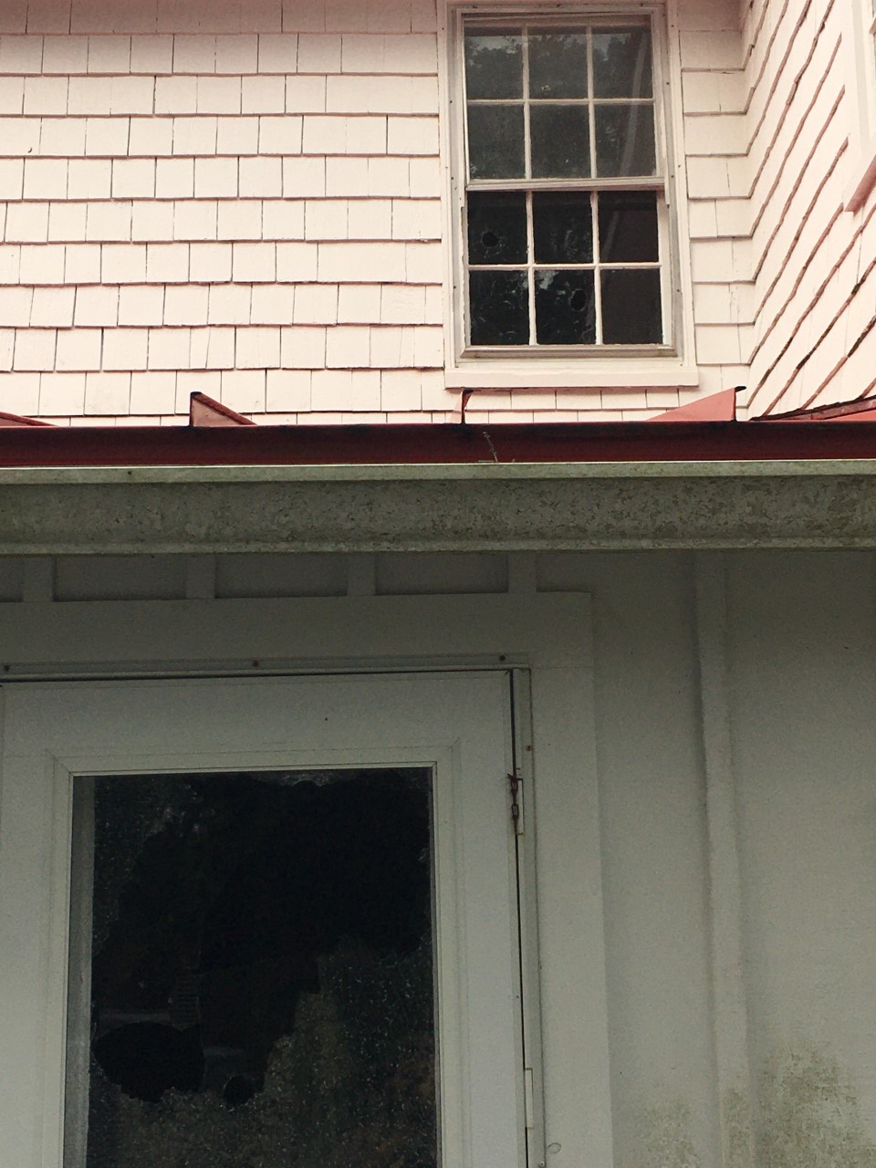 Damage to door and window at Ocracoke Light Station.