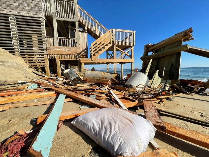 Large amount of household debris near site of house collapse.