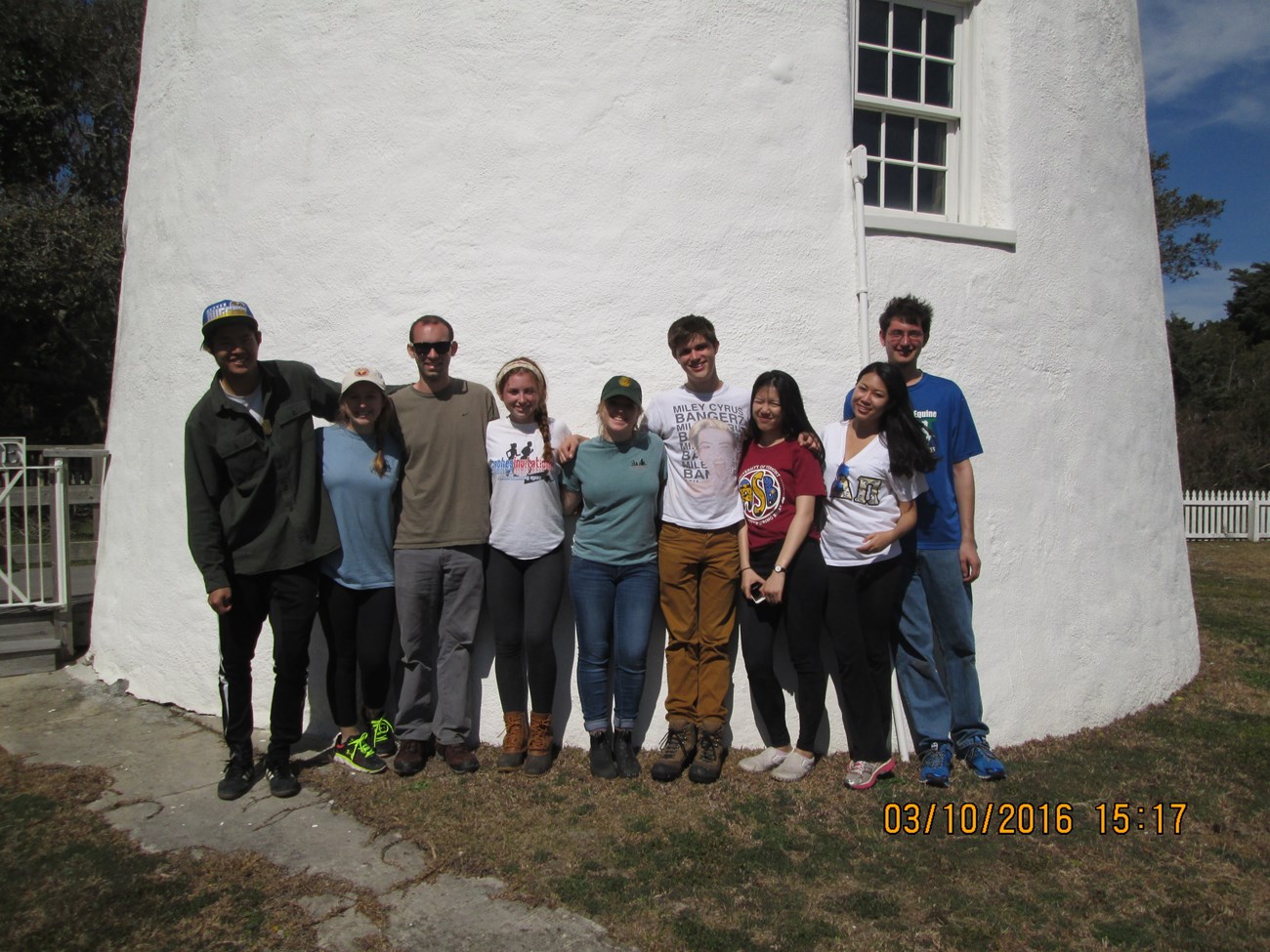 UVM students in front of Ocracoke Lighthouse