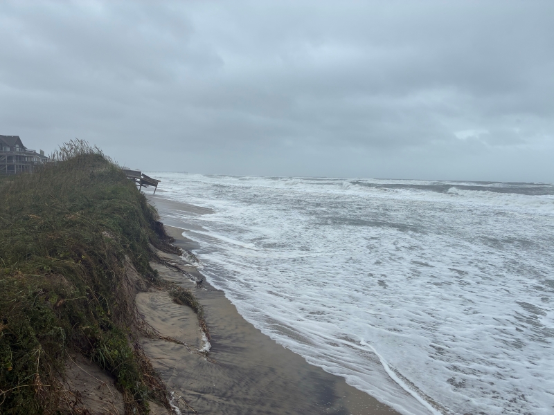 Ocean water covers most of the beach.