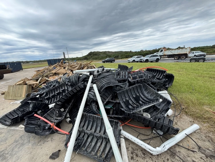 Photo of some of the private house debris collected by Seashore staff at Old Lighthouse Beach Photo showing a large collection of black septic pieces.