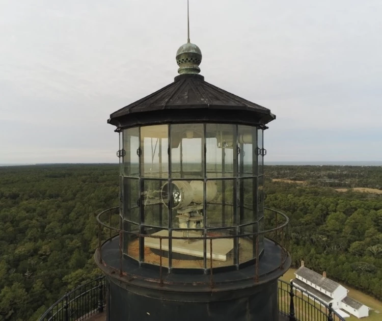 Photo of the Cape Hatteras Lighthouse's lantern room and current beacon. Aerial photo of the current beacon at Cape Hatteras Lighthouse.