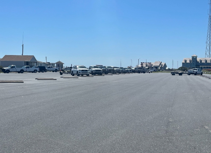 Image of paved parking lot without lines.