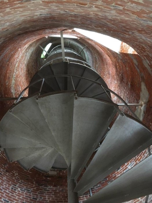 View from the base of the Ocracoke Lighthouse looking up spiral stair case.