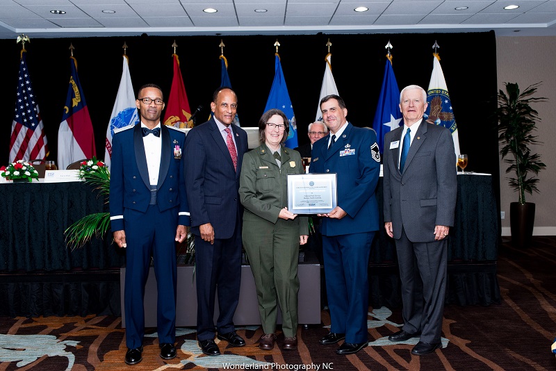 Photo of Park Ranger Chris Cabral and Mary Doll accepting the Above and Beyond Award.