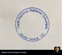 Blue circular stamp that says, "Cape Hatteras National Seashore, Bodie Island, NC."