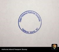 Blue, circular stamp that reads, "Cape Hatteras National Seashore, Hatteras Island, NC."