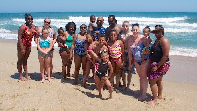 Visitors on the seashore near the old Cape Hatteras Lighthouse location