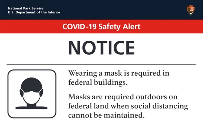 sign explaining mask requirements
