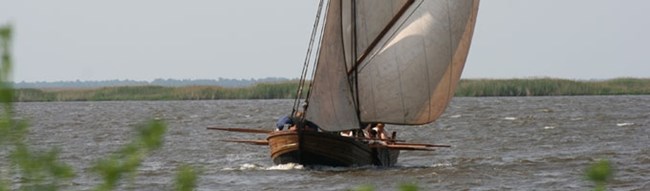 A replica shallop is sailing on the James River A replica shallop is sailing on the James River