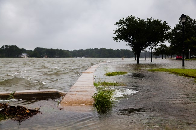 The Lafayette River overflows the shoreline in Norfolk, Virginia during a storm.