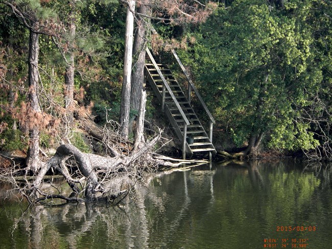 Shoreline erosion is visible on a riverside.