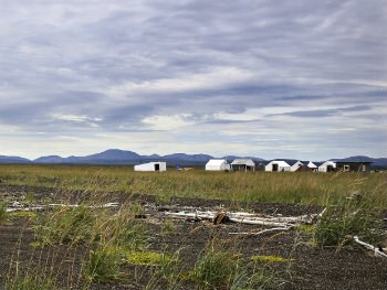 white frame tents near the beach