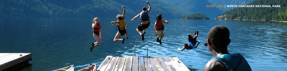Photo: Kids jumping in unison off a dock into a lake