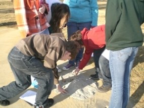 Students doing an experiment testing barrier island development