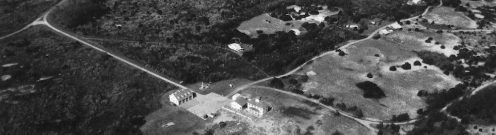 Aerial view of Cape Lookout Village with Coast Guard Station in center.