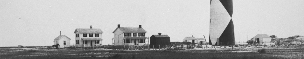 The other buildings of the Cape Lookout Light Station clustered around the base of the lighthouse. The other buildings of the Cape Lookout Light Station clustered around the base of the lighthouse.