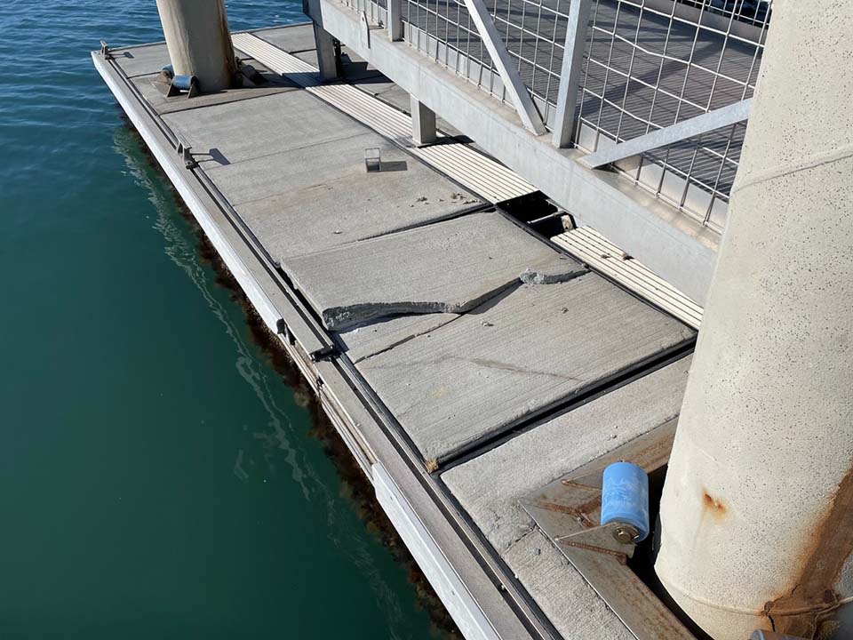 Damage to Lighthouse area floating dock caused by recent winter storm conditions Cracked deck surface in the floating dock caused by recent storm activitiy