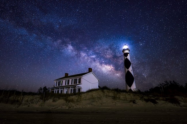 Milky Way in the sky over the Cape Lookout Lighthouse and Keepers' Quarters