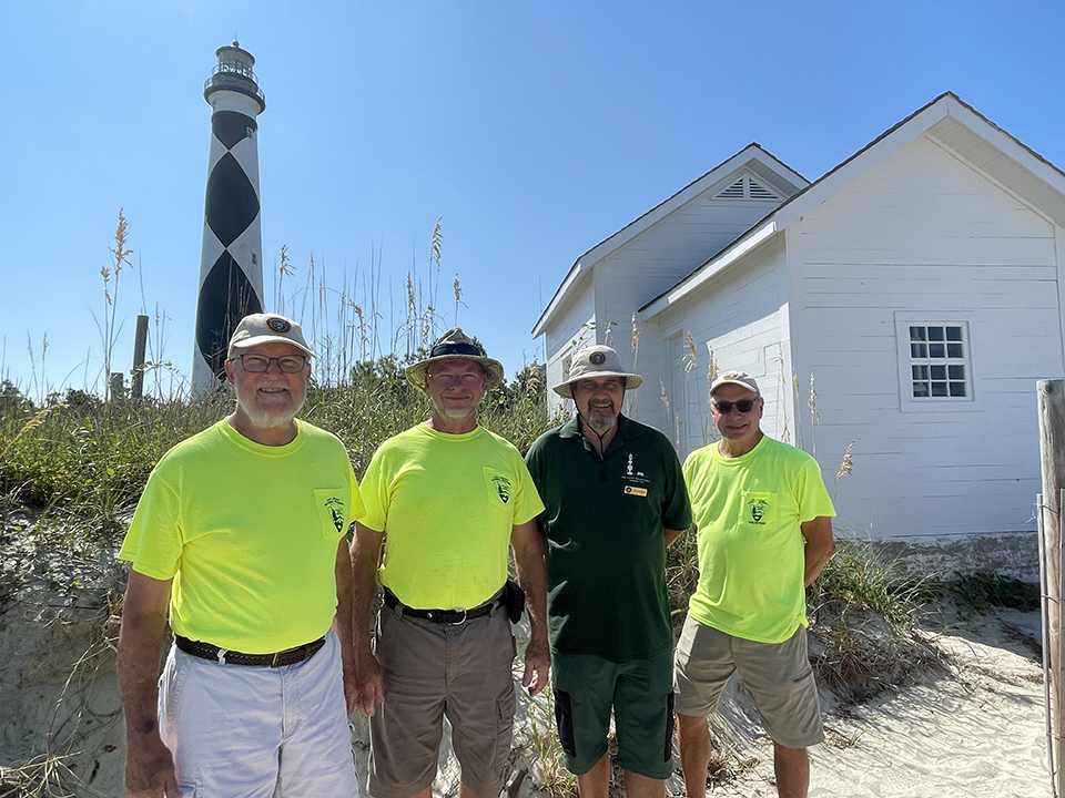 Volunteers of the Year -- From Left to Right - Al Heltzel, Lawrence Scotty Scott, Tom Atkinson, Rich Rehm pose in front of completed Summer Kitchen_960 px 2022 Volunteers of the year