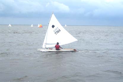 Small sailboat racing in the sound. Small sailboat racing in the sound.