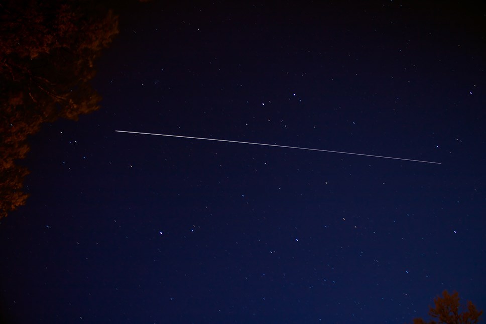 International Space Station leaves a streak as it passes overhead Light streak across a starry sky