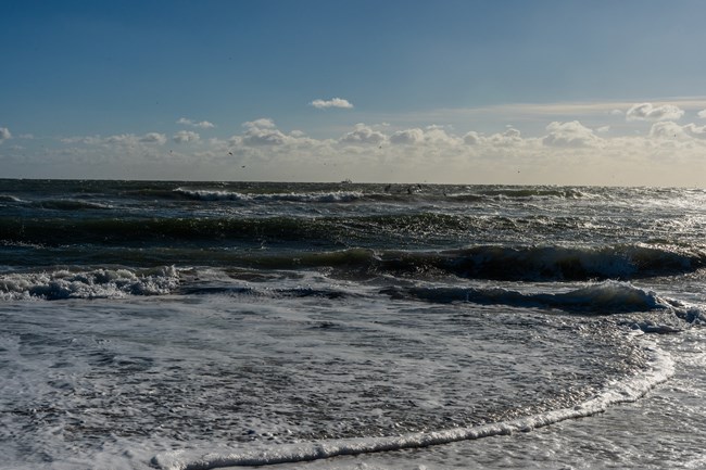 Water crashing along the shoreline.