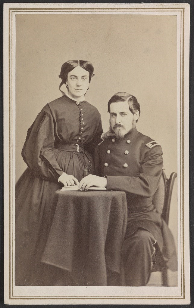 Charles F. Walcott in US Army uniform sitting while his wife stands next to him during the Civil War.