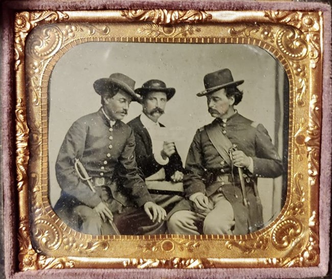 Three US Army officers in military uniform during the Civil War.